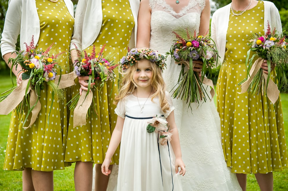 polka dot bridesmaids dresses and flower girl with floral crown