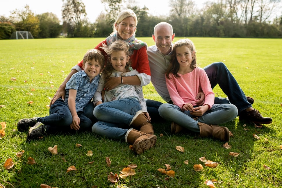 relaxed outdoor family portrait of family of five during family photoshoot