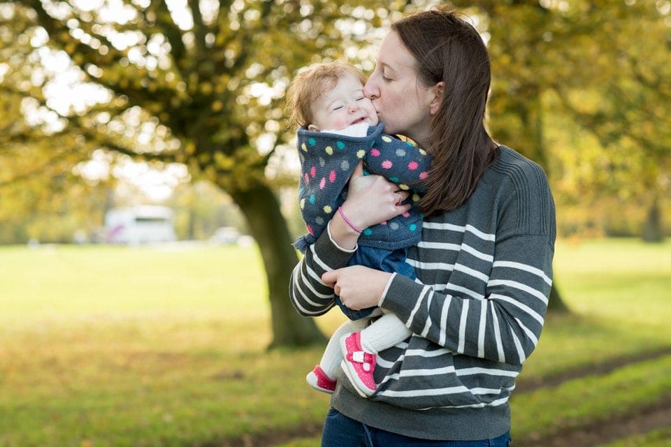 mummy kissing happy daughter on leicestershire family photoshoot