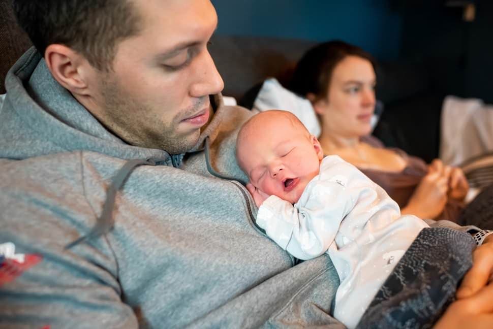 dad cuddling brand newborn baby st albans