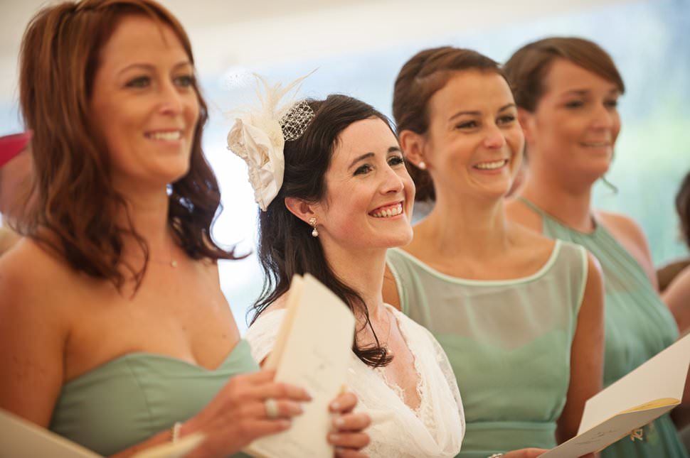 laughing bride in Hertfordshire marquee wedding