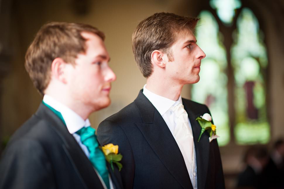 nervous groom waiting at hertfordshire church