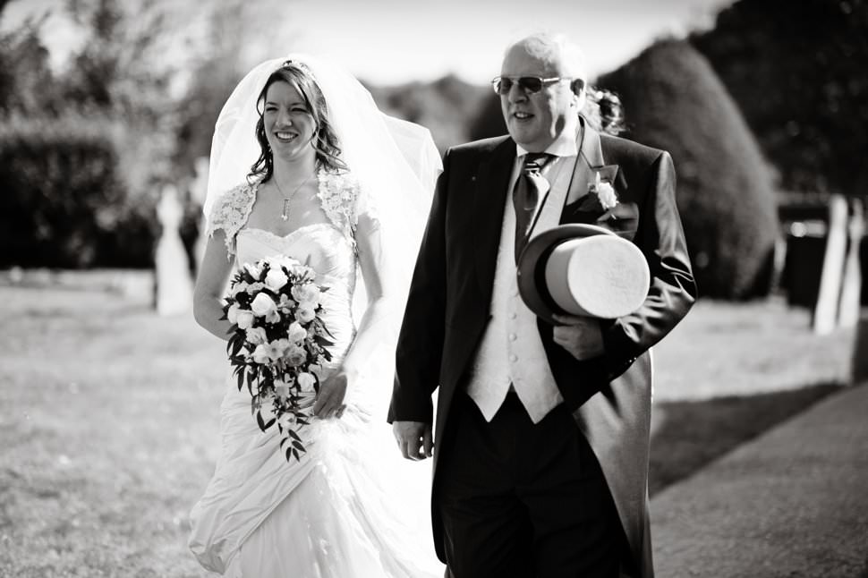 bride and dad walking to church marriage
