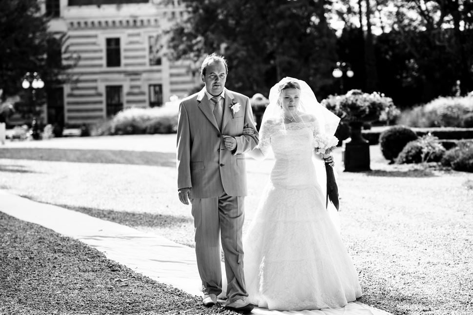 walking down aisle at french chateau wedding