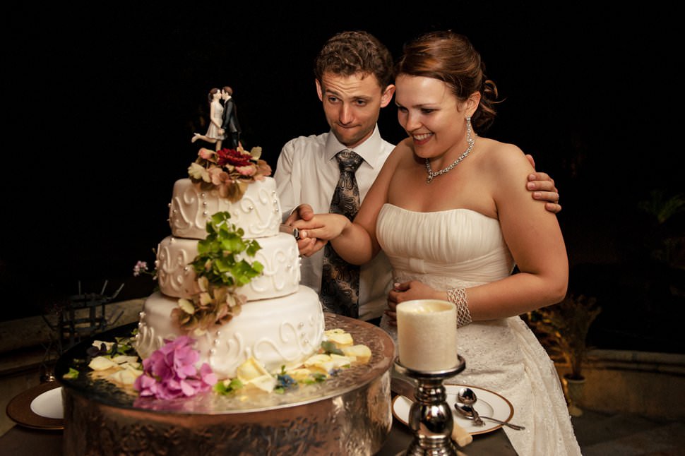 cutting cake at castle wedding