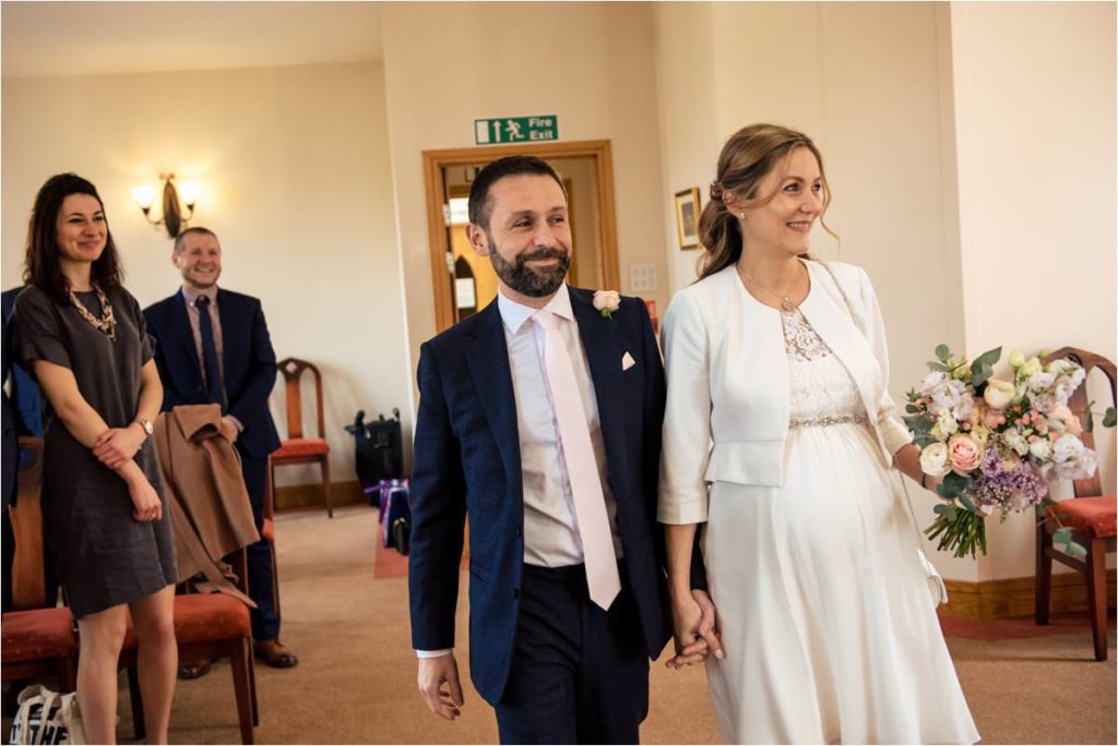 Bride and groom enter St Albans Registry Office wedding.