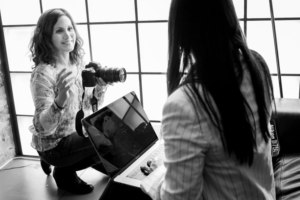 Photographer taking photos of a client