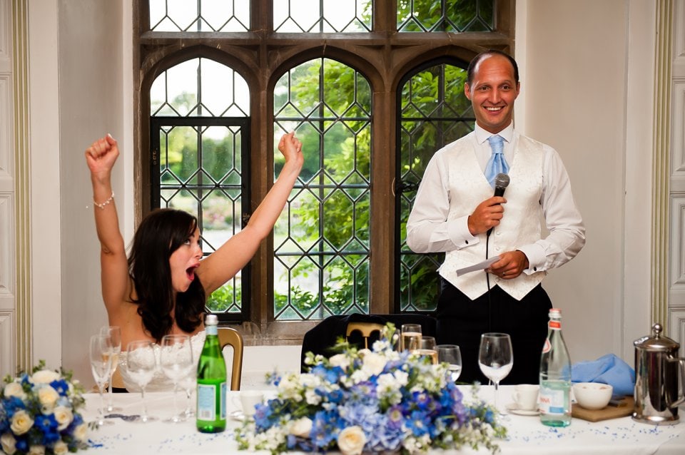 Bride cheers groom's speech at Hengrave Hall wedding