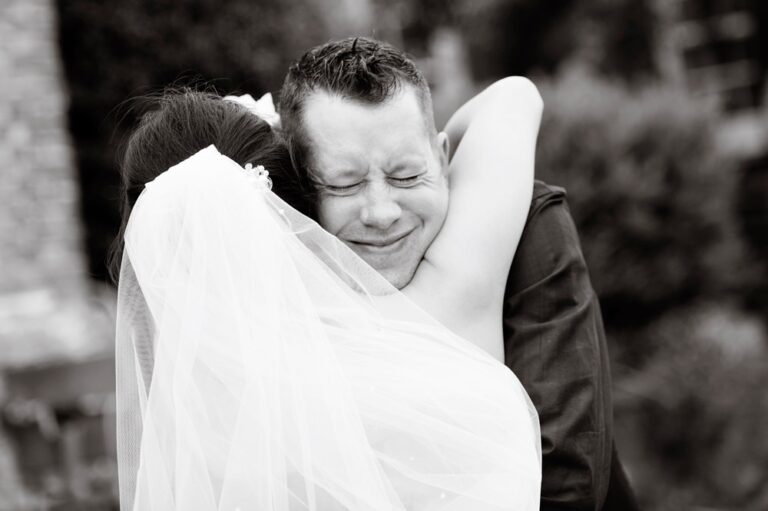 Bride and groom share emotional embrace at Hertfordshire wedding
