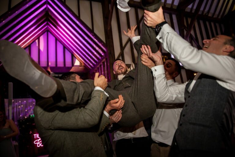 Groom trousers rip during dancing when friends throw him in the air at Hertfordshire Essendon Country Club wedding