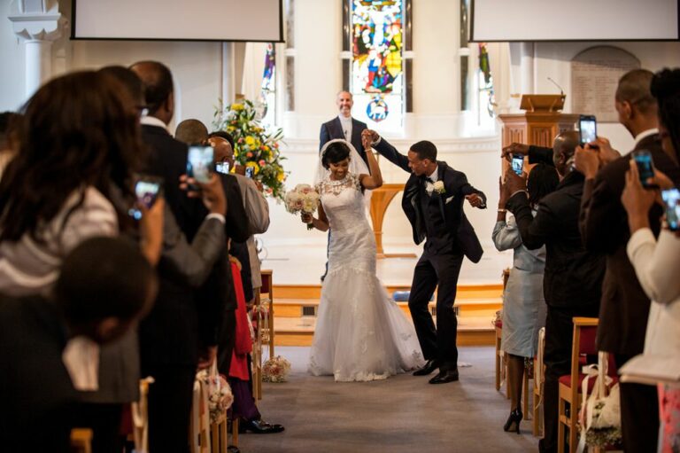 Bride and groom dance back down the church aisle at Hertfordshire wedding
