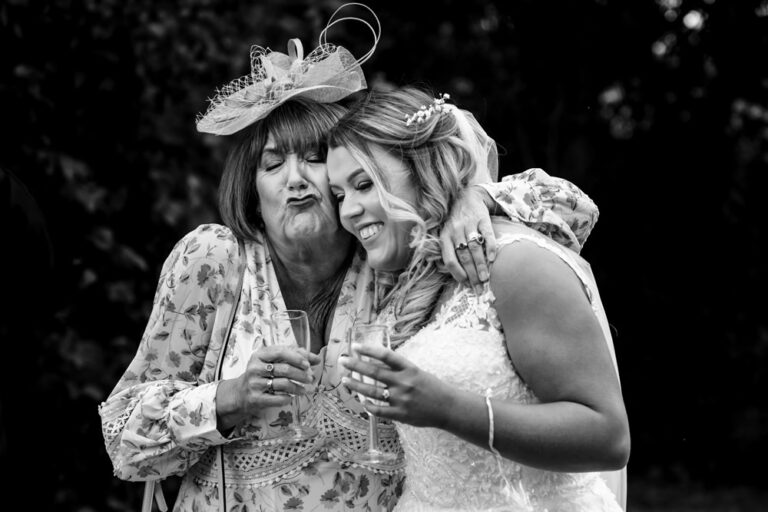 Bride hugs mother of the bride after wedding ceremony at Hertfordshire wedding