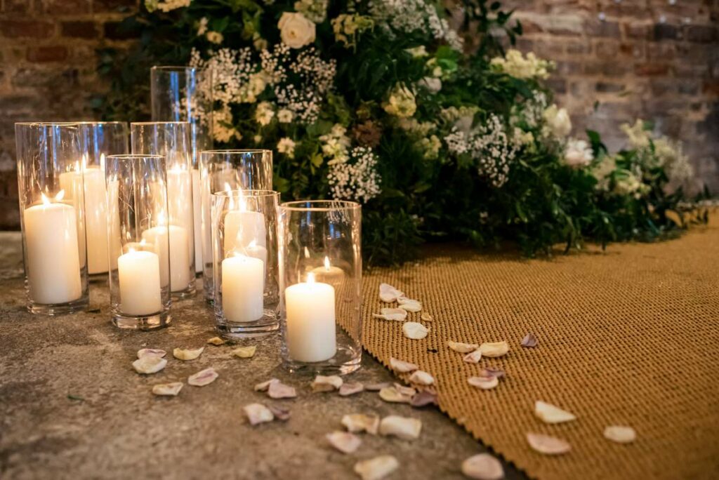 Candle and flower alter backdrop at Milling Barn