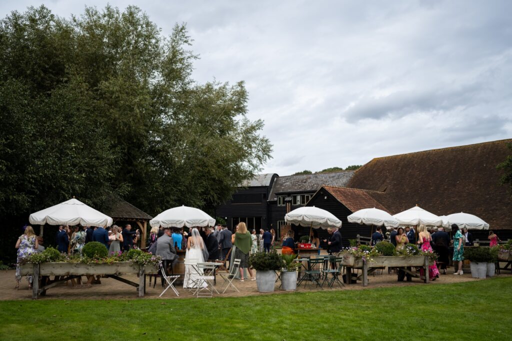 Tewinbury Farm patio are during drinks hour at a wedding