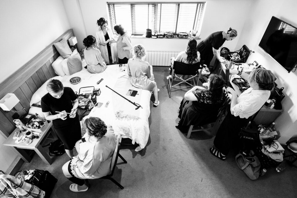 Black and white photo of Tewinbury Farm bridal suite from above with bride and bridesmaids getting ready