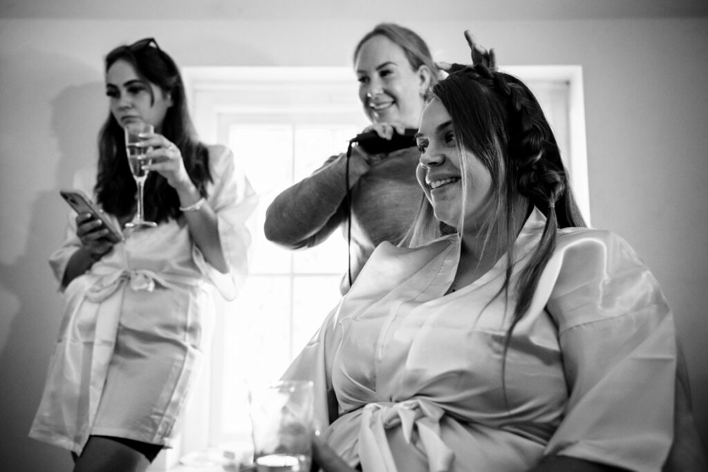 Hair being done during at home wedding