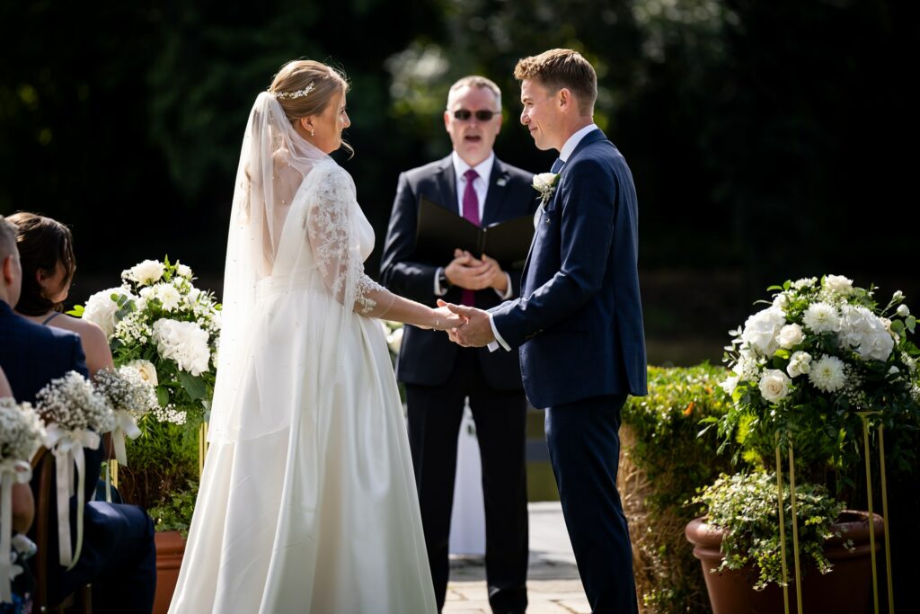 Bride and groom exchange vows at St Michaels Manor wedding