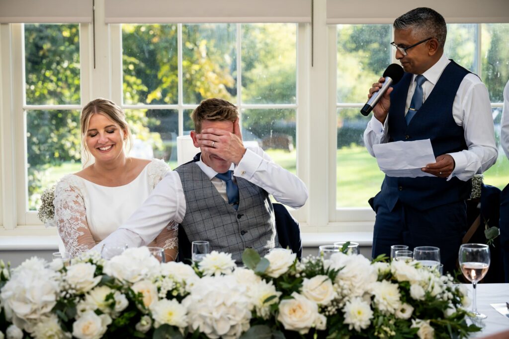 Bride and groom react embarrassedly to bestman speech