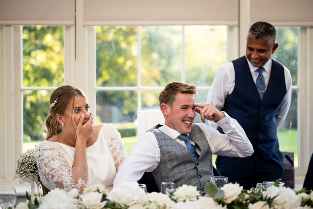Bride looks shocked at bestman speech at St Michaels Manor