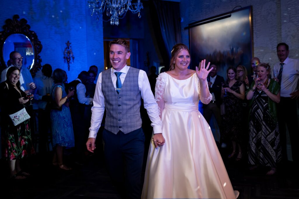 Bride and groom enter reception for first dance at St Michaels Manor