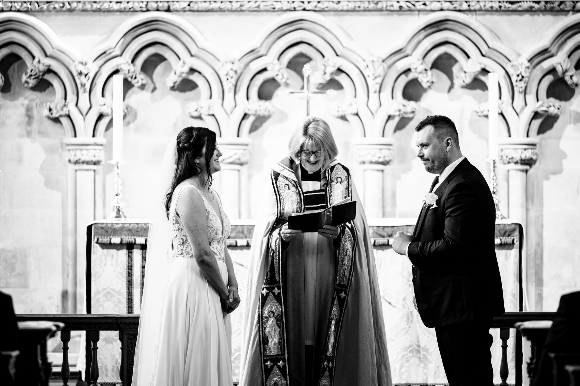 Groom does subtle fist pump during wedding ceremony at St Albans cathedral