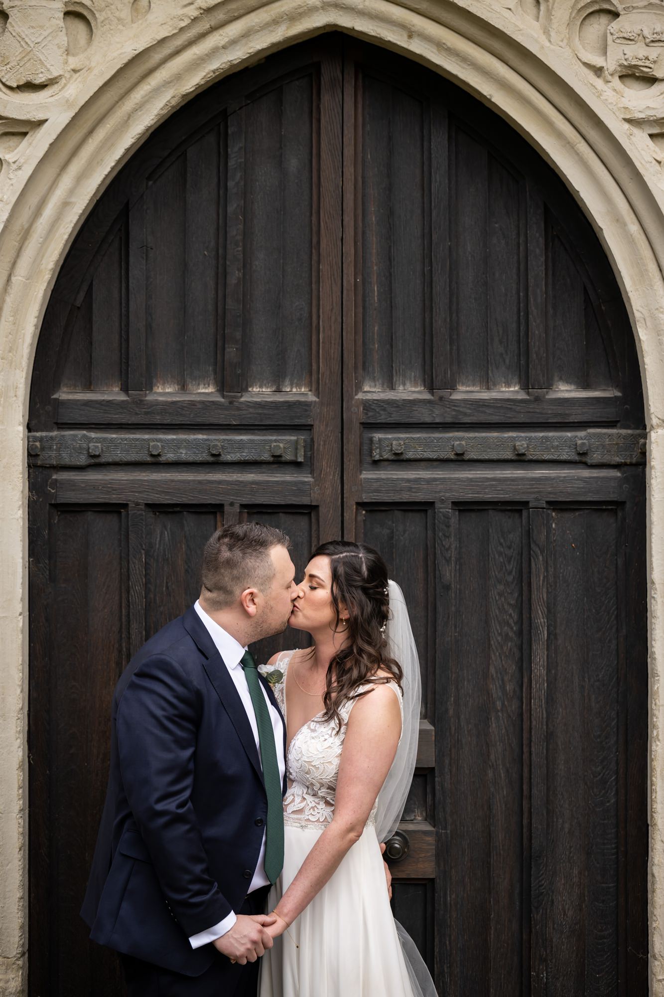 Couple kiss in doors of St Albans cathedral, Hertfordshire