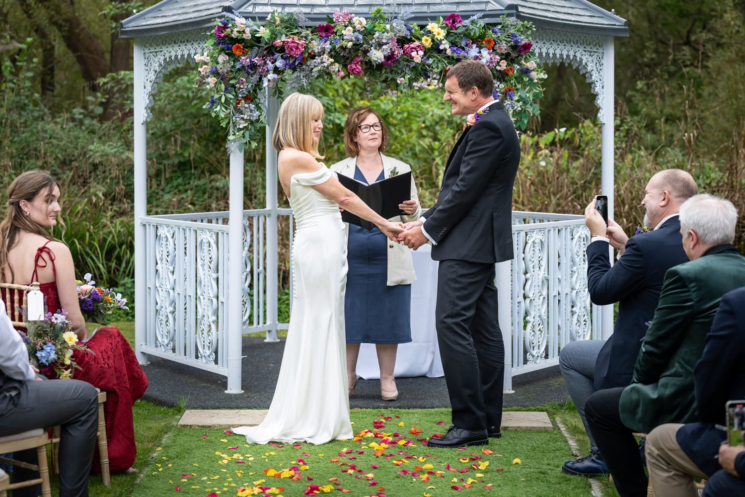 Bride and groom grimace during objection part of wedding at Waterside Venue wedding in Hertfordshire