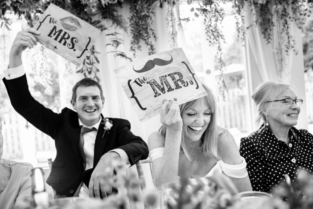 Bride and groom play Mr & Mrs game during wedding breakfast at Waterside Venue Hertfordshire