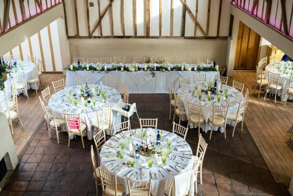 Barn laid out for wedding breakfast at Coltsfoot wedding venue Hertfordshire