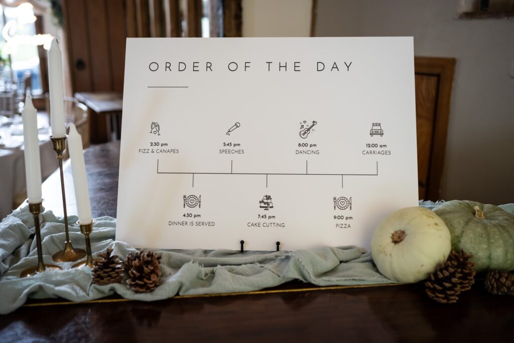 Order of the day sign with pumpkin and sage green