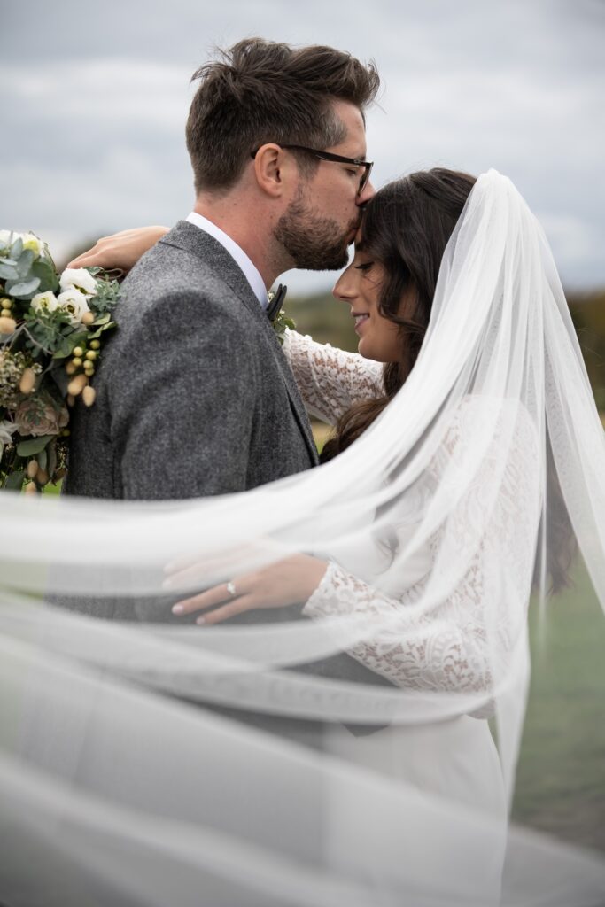 Bride and groom portrait with veil at Coltsfoot wedding venue Hertfordshire