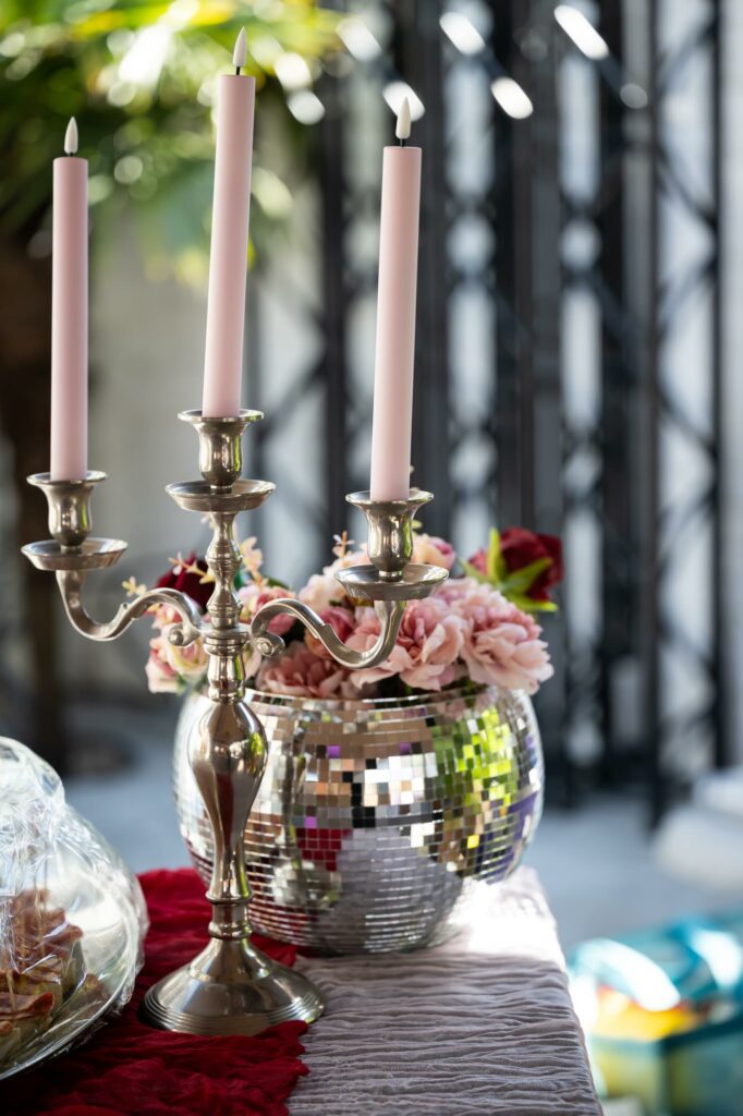 Pale pink taper candelabra and glitter ball flower wedding table decorations