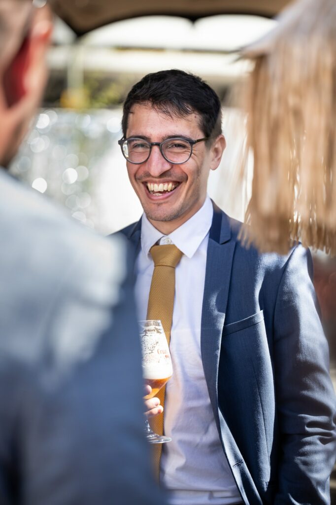 Happy wedding guest natural candid photos at pub wedding reception