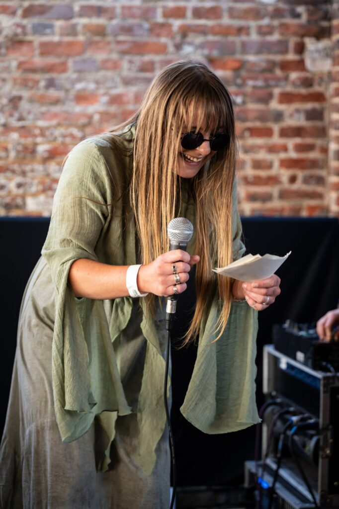 Best woman makes funny speech and sings to bride and groom at relaxed pub wedding reception
