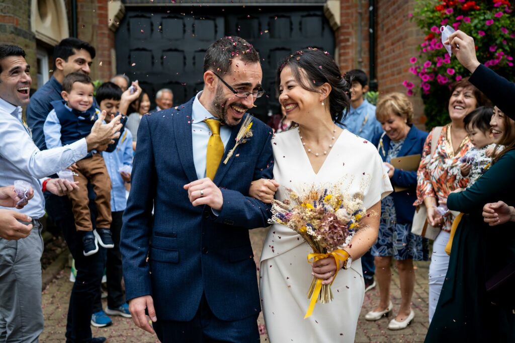 Bride and groom leave their wedding ceremony to confetti and cheers at the St Albans Register Office