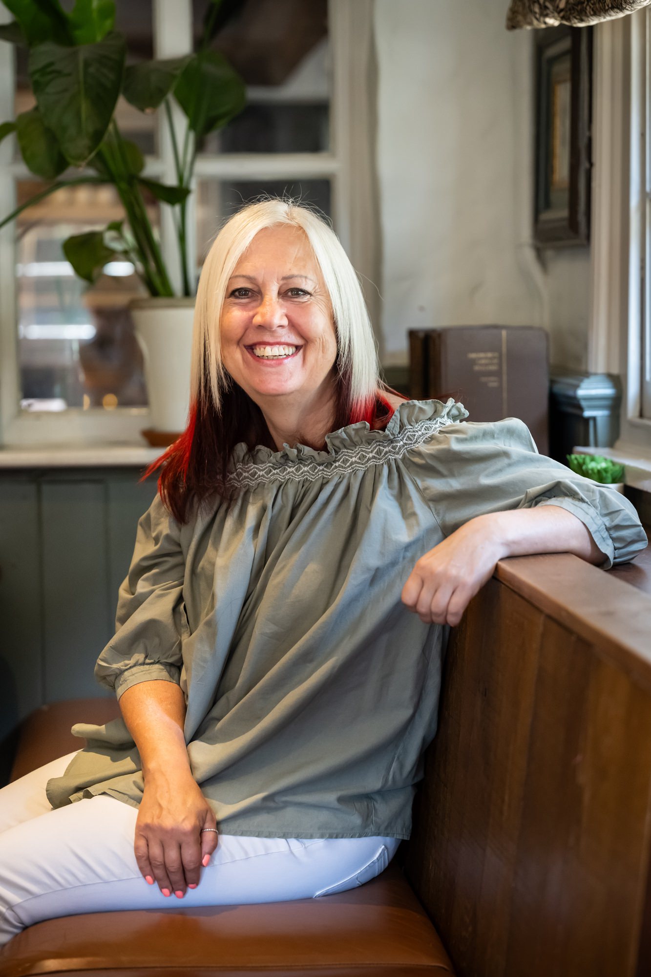 Relaxed headshot of Hertfordshire business woman in local venue