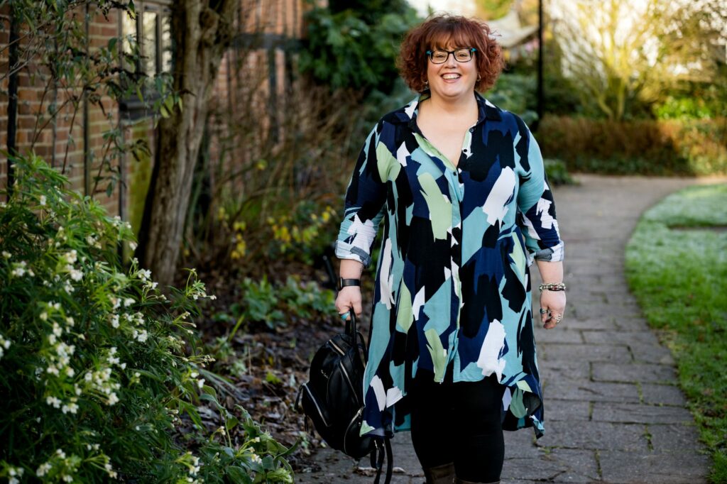Hertfordshire business woman walking towards camera in greenery
